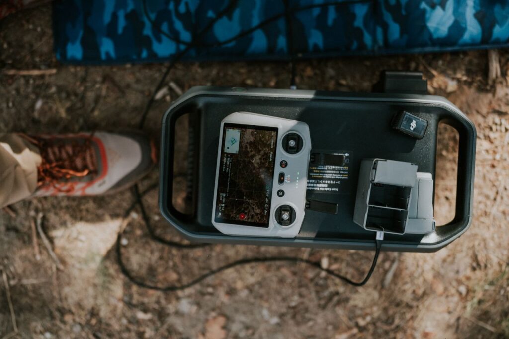 Aerial drone controller setup outdoors on a dusty ground in Guanajuato, Mexico.